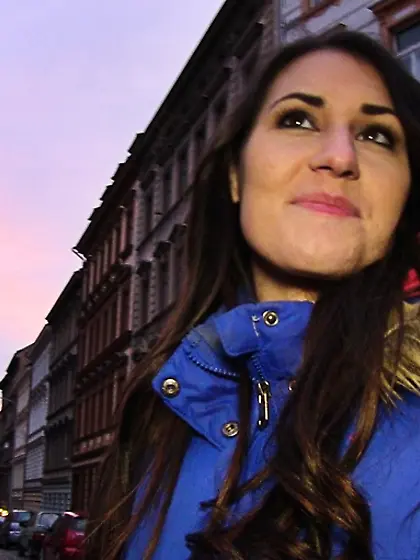 Tattooed brunette blue jacket