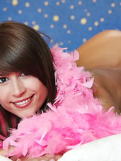 Petite young hussy with pink boa on poses spreading nude pussy o