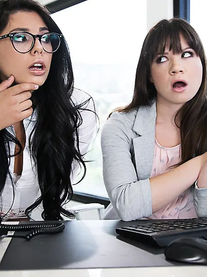 Two hot ladies are enjoying queer fucking at the office