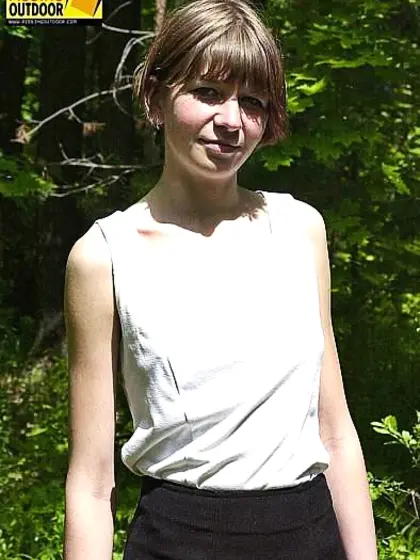 Peeing girl in forest