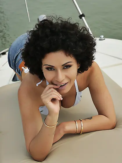 Curly-haired beauty with big natural tits gets sodomized on yach