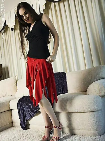 Raven haired Sasha Grey in red skirt strips naked and shoves blu