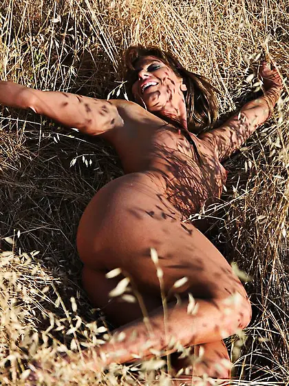 Like the wild tigress this sexy nude babe Ariel X is hiding in t