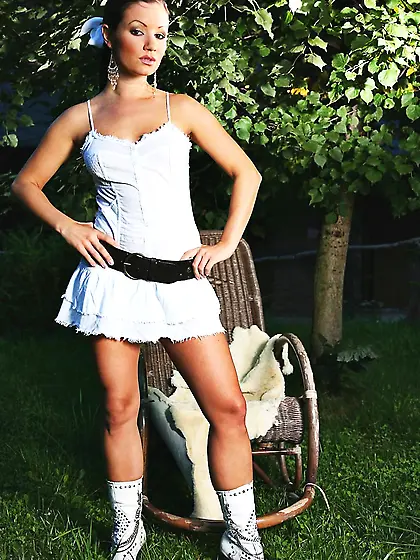 Brunette Jana Mrazkova strips her garments in the garden and mas