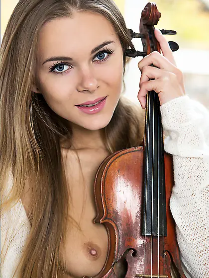 Gorgeous golden haired Dana P loves posing with her violin and o