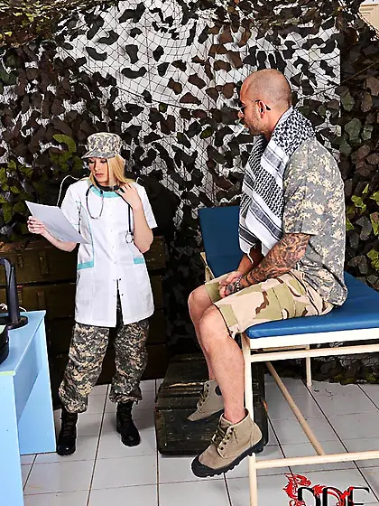 Skillful military nurse treats the patient by taking his dick in