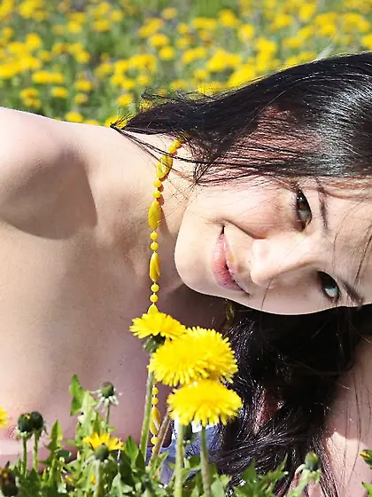 Pale-skinned brunette showing her goodies in a beautiful field V