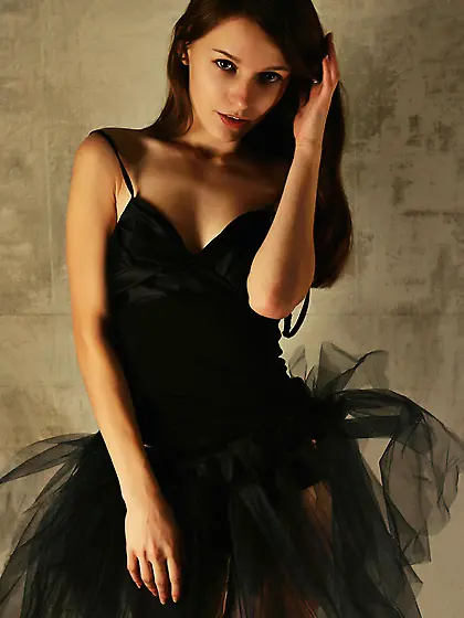 Dark-haired beauty in black panties showing off her pussy next t