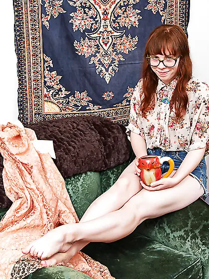Nerdy redhead with bangs and pale skin proudly presents hairy pu