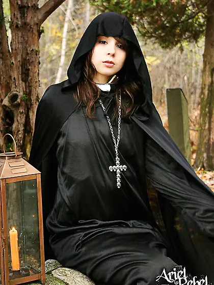 Naughty teenage nun Ariel Rebel dressed in black flashes her bal