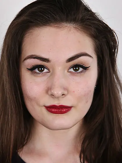 Brunette chick with red lipstick on and mesmerizing look feels f