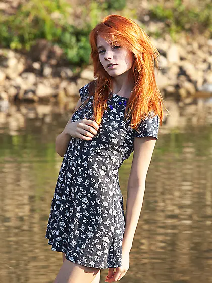 Free-spirited redhead becomes closer with the nature by relaxing