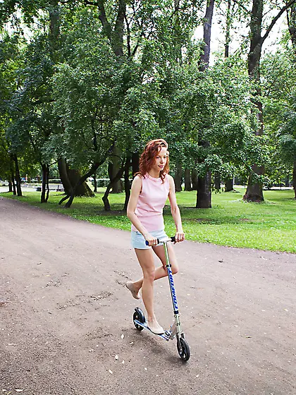 Curly-haired redhead shows off her extremely bushy pussy up clos