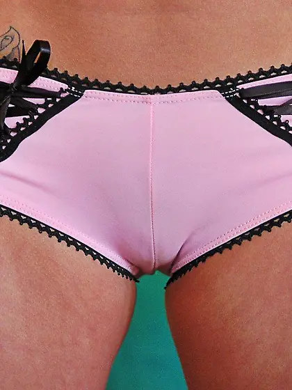 Good looking blonde posing with her hairless pussy in full view