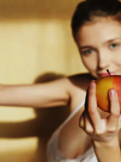 Young sweetheart enjoys eating fruit and reveals big boobs when