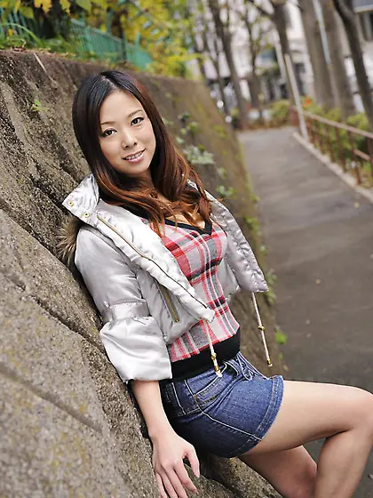 Asian chick in a short jeans skirt Asuka is sexily posing in the