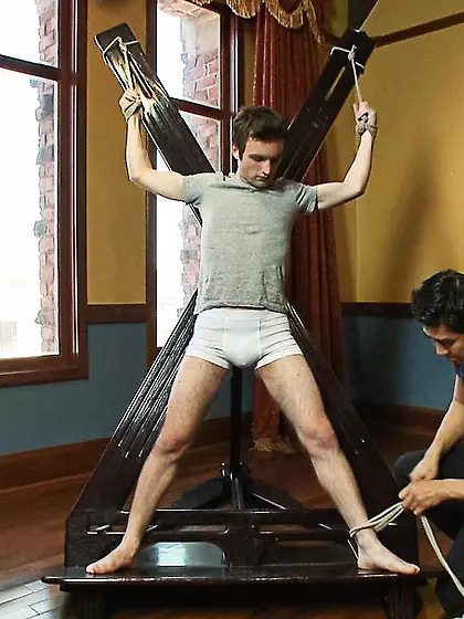 Cheerful gay man tied