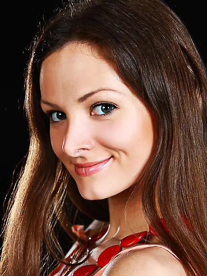 Cute young girl takes her piano lessons seriously