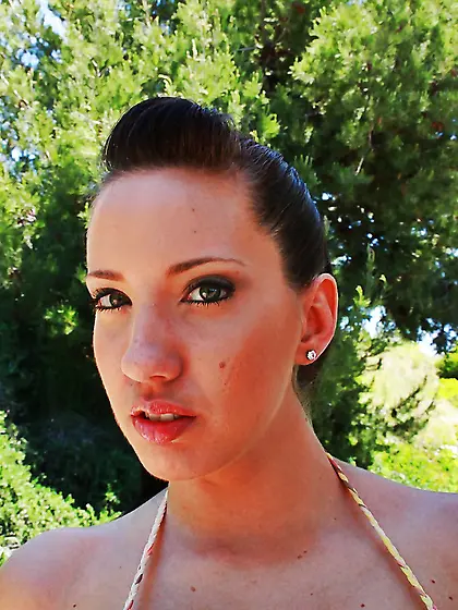 On a hot summer day the hottest brunette bares big fake breasts