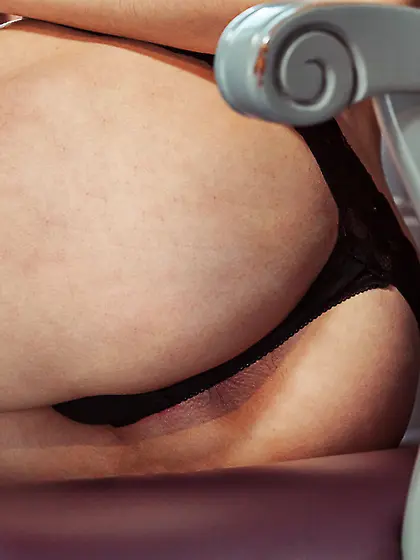 Ponytailed hottie with a pale body showing off her holes on a ch