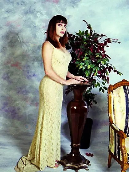 Sexy shemale in a vintage chair