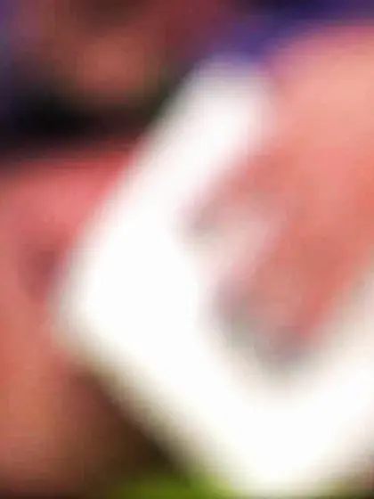 Pale pigtailed redhead licking