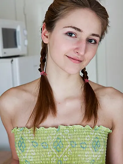 The redhead teen Dacey Karups is petting the young pussy covered