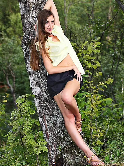 Leggy teen babe Sofy B plays naked in the woods showing her cute