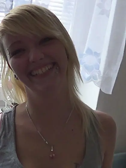 Blonde with piercings is swallowing a hard...