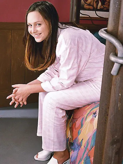 Charming babe relaxing after a shower creaming her nude body and