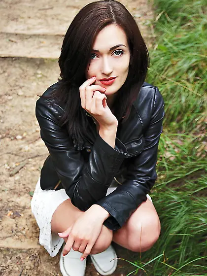 Auburn-haired beauty takes off her short white dress to pose nak