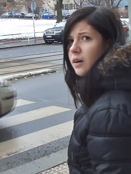 Black-haired teen is trying to swallow a...