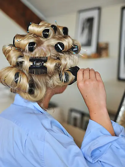 Sexy blonde Kate takes out her curlers while in her bra and unde