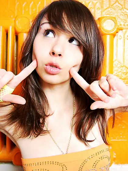 Sexy and beautiful solo babe,  Ariel Rebel eating orange and play