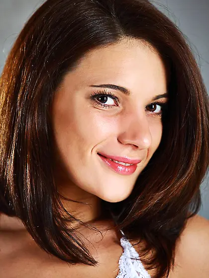 The brunette cutie Milla Yul is slowly taking off her white dres