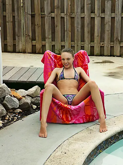 Sultry bikini girl Aubrey Star has bathed in the pool and stretc