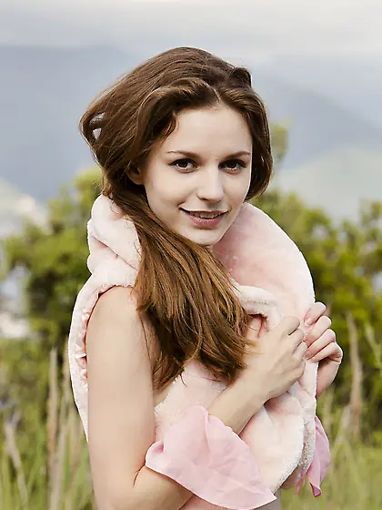 Brown-haired beauty in lace lingerie gets naked with her ass on