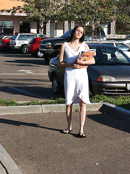 Jassie James takes her white dress outdoors on the parking lot a