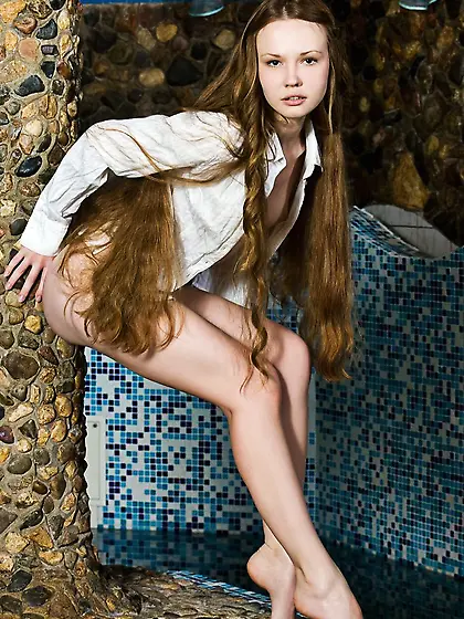 The long haired bimbo Virginia Sun is bathing in the pool absolu