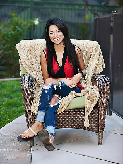 Latina in ripped jeans fingering her dripping pussy close up