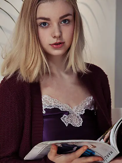 Blond-haired teen in a purple nightie flashing her teen pussy fo