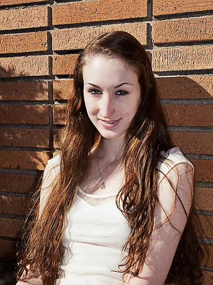 This long-haired teen girl adores exercising