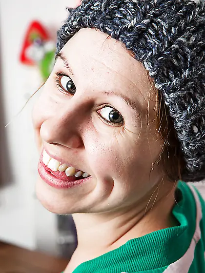 Girl with a cute smile shows her boobs in see through bra