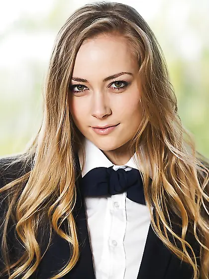 Slim pornstar gets rid of schoolgirl uniform and teases with her