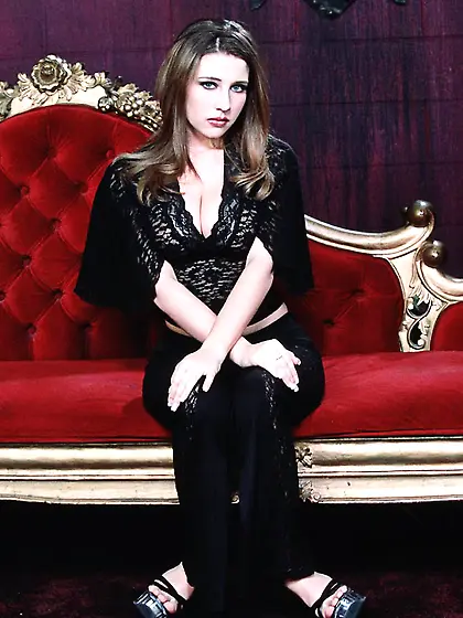 Erica Campbell relaxes on her couch while driving you wild with