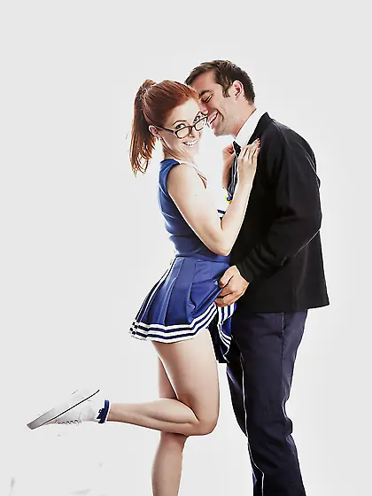 Funny red-haired high-school cheerleader Penny Pax strips while