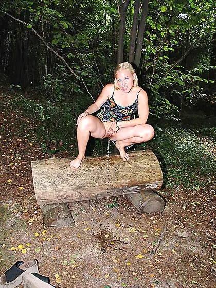 Teen blonde pissing on the forest bench