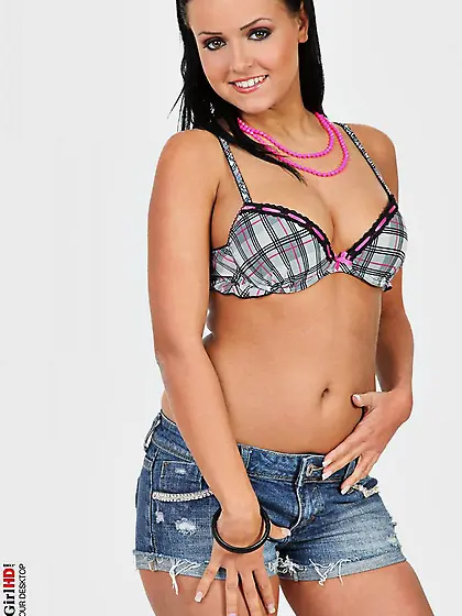 Hot busty brunette Laetitia in the tiny jeans shorts and without