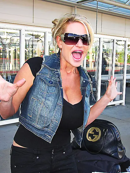 Hot big breasted slut Kelly Madison strips and shows her mammoth