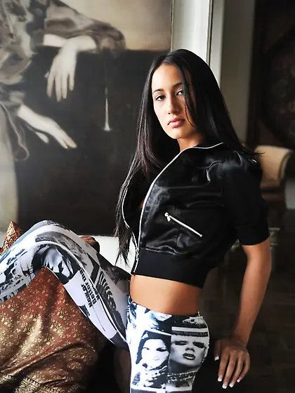 Raven-haired chick with tiny tits takes off tight leggins and fl